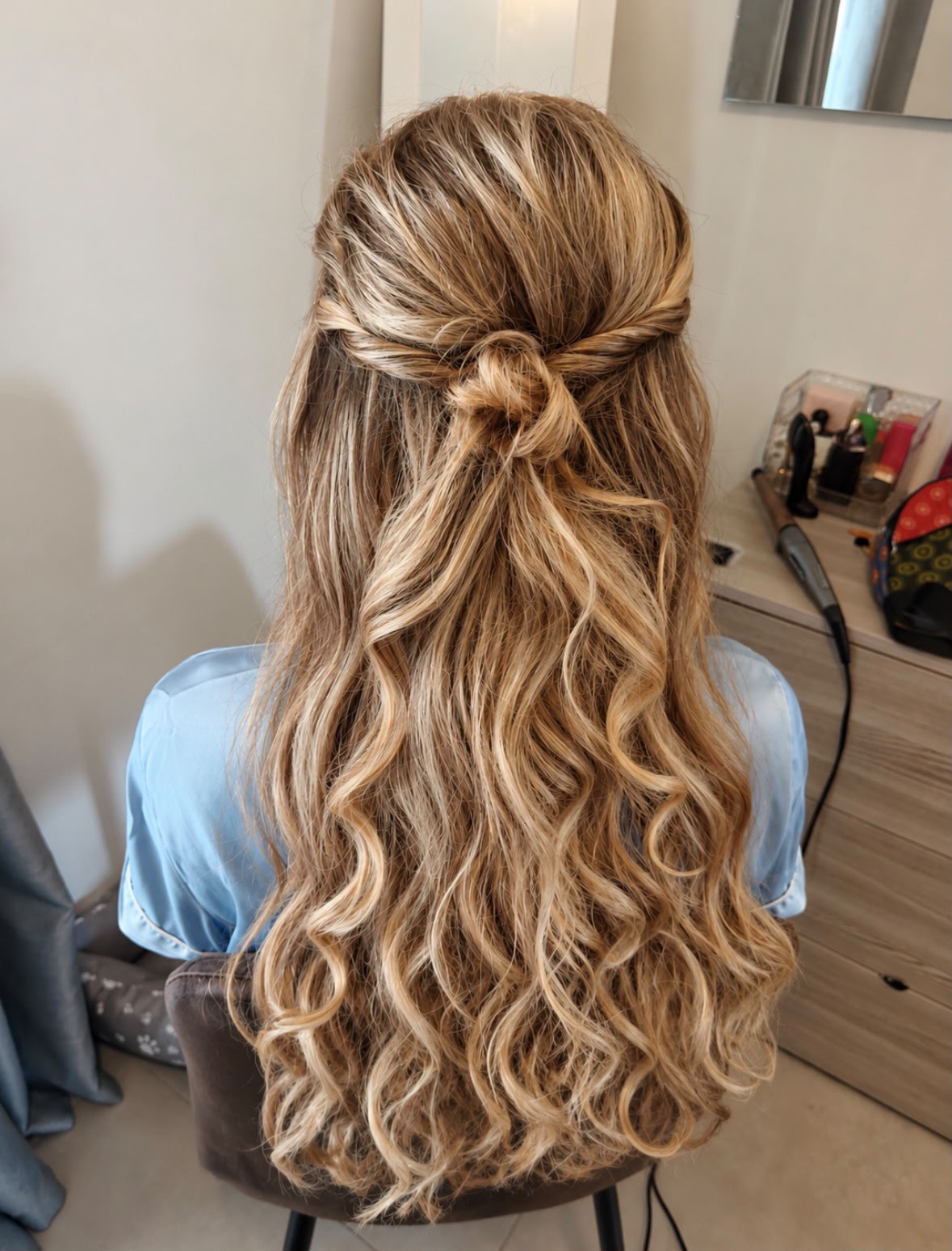 Blonde half up twisted style with curls